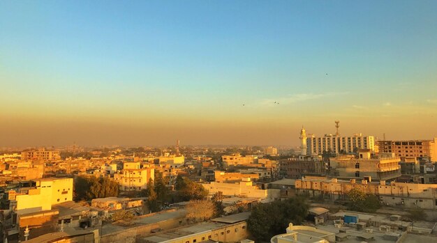 View of cityscape against sky during sunset