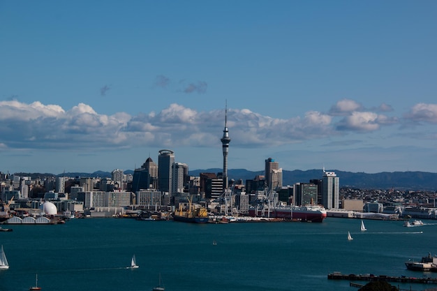 View of cityscape and sea against sky