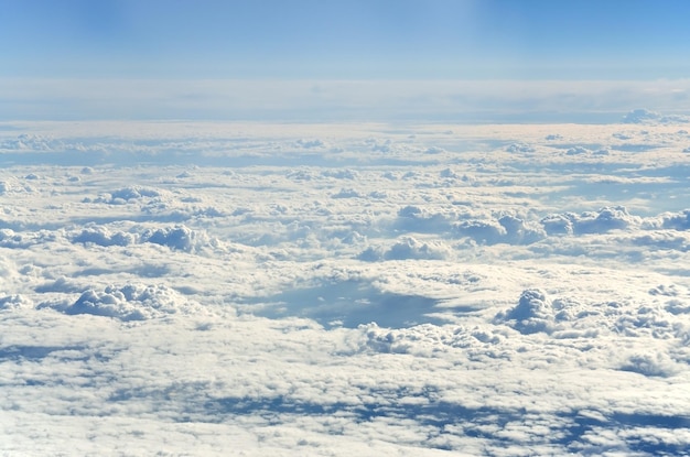 Photo view of clouds as seen from an airplane window