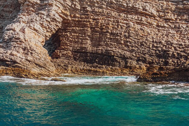 View of coastline rocks with clear turquoise water