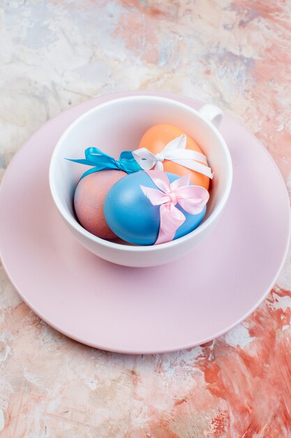 above view colored easter eggs inside cup on light background horizontal holiday concept ornate spring easter colourful