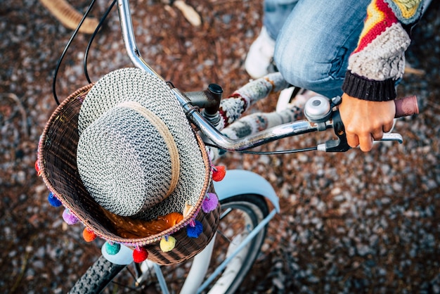 Above view of coloured trendy accessories and woman people ride a blue bike 