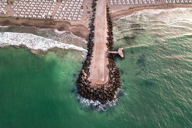 view of a concrete pier on the seashore