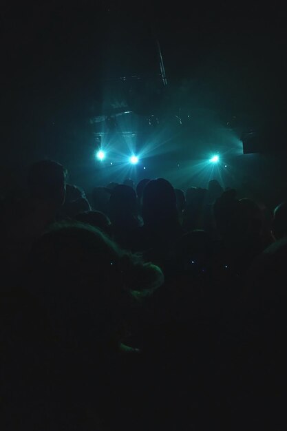 Photo view of crowd at music concert in night