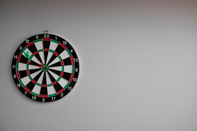 Photo view of dartboard with bullseye arrow points