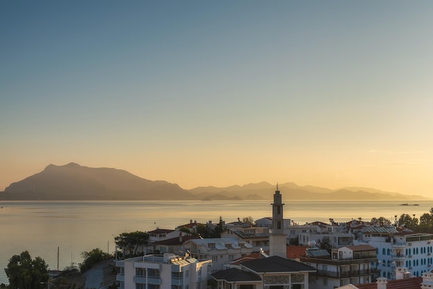 View on Datca town with harbor and island at sunrise Mugla province Turkey Popular tourist summer destination in Turkey