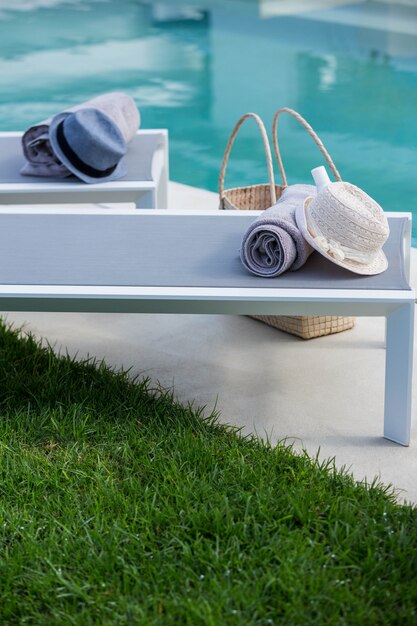 Photo view of deck chairs by the pool