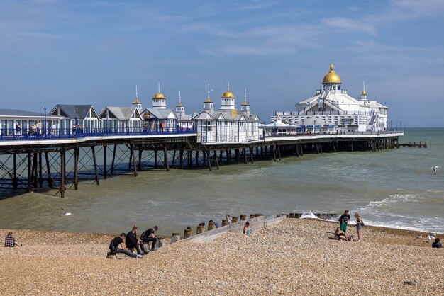 View of Eastbourne Pier in East Sussex on July 29 2021. Unidentified people