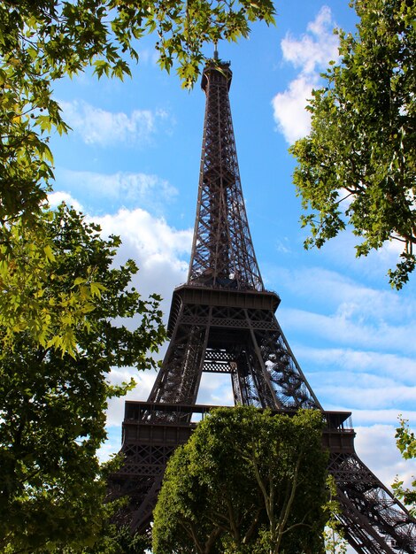 View on Eiffel tower under sunny summer sky.