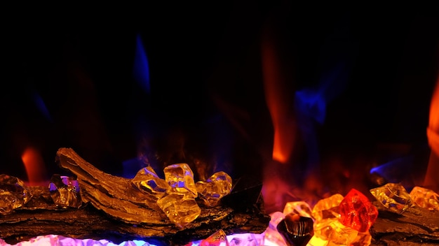 View on electric fireplace with artificial sparkling flame decor interior blue and orange flame