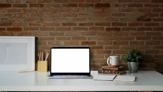 Photo view of electric lamp on table against brick wall