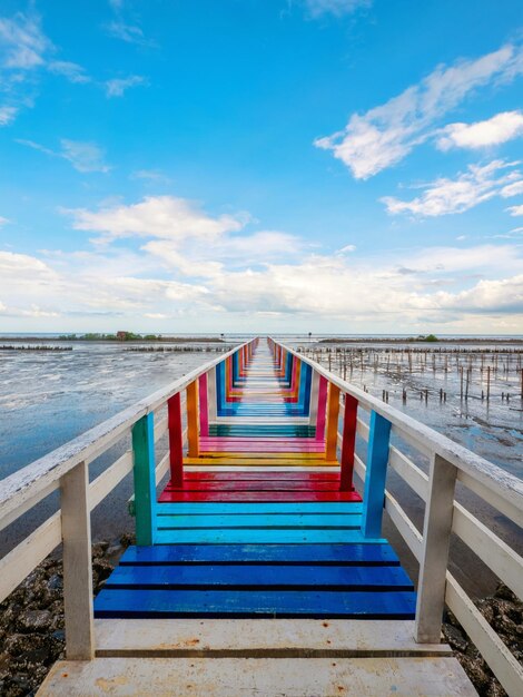 View of empty bridge over sea against sky rainbow bridge and seaside bridge bright colors