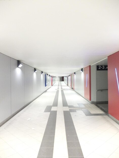 Photo view of empty corridor along walls