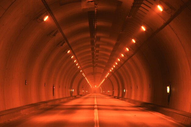 Photo view of empty illuminated tunnel