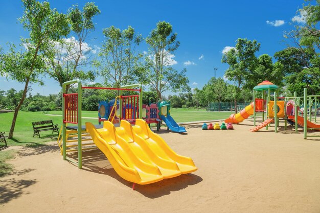 view of empty playground against trees in park