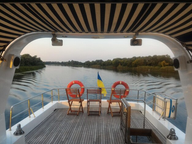 View of empty yacht deck on the lake against sky