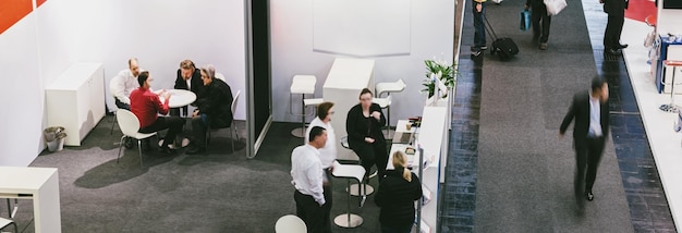 View of exhibition booths on a fair with blurred people. copyspace for your individual text.