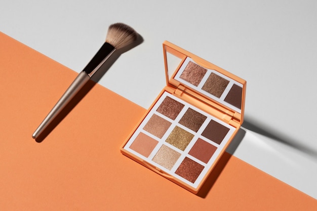 View of eyeshadow palette with brush applicator