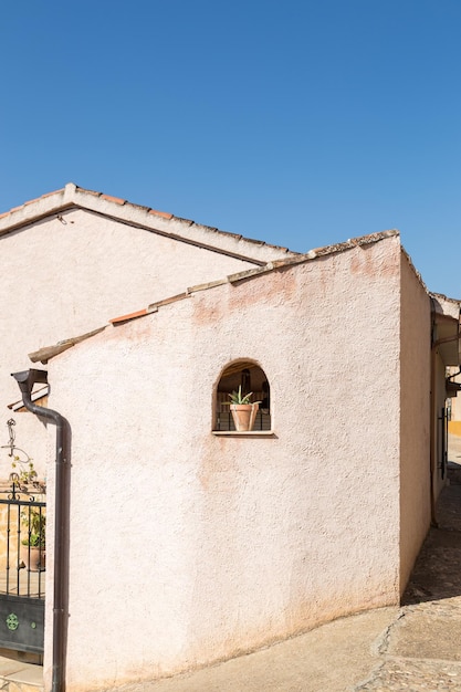 View of a facade with a window where there is a pot