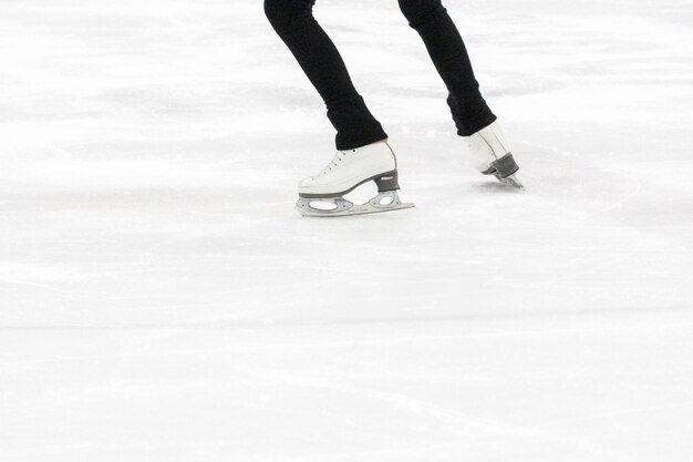 View of figure skater feet at the figure skating practice.