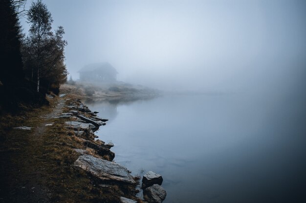 Photo view  on foggy lake mortirolo in mountain