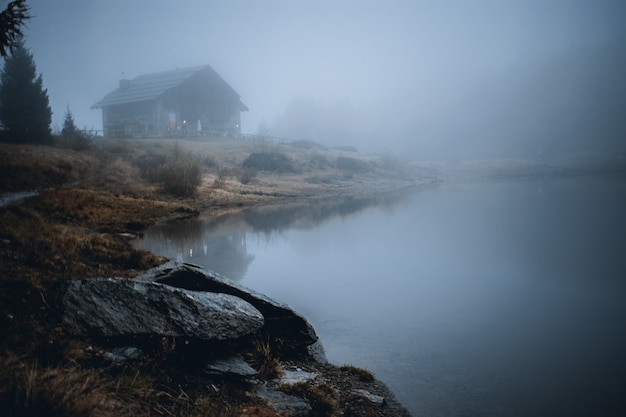 View on foggy lake mortirolo in mountain