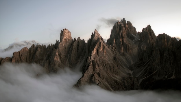 View of foggy Tre Cime di Lavaredo in Dolomites, Italy