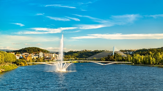 View of a fountain on the Mondego river in Coimbra, Portugal