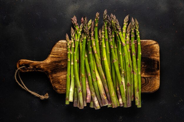 View of fresh asparagus on a black table