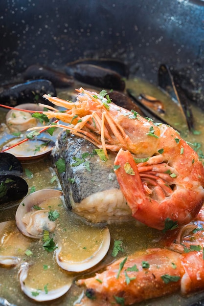 View of fresh seafood pot with shrimp mussels and various types of clams