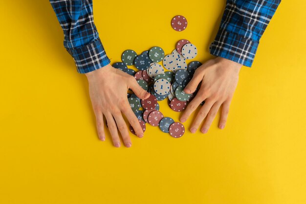 A view frob above, player wins a game in casino and grab all the chips on the table