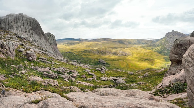 View from Andringitra massif as seen during trek to Pic Boby Imarivolanitra, Madagascar highest accessible peak. Small person in bottom left corner for scale.