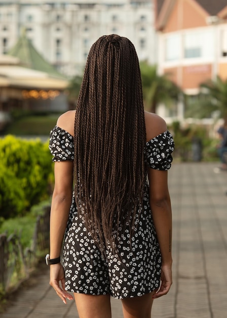 View from back of girl with rblack dreadlocks from kanekalon.