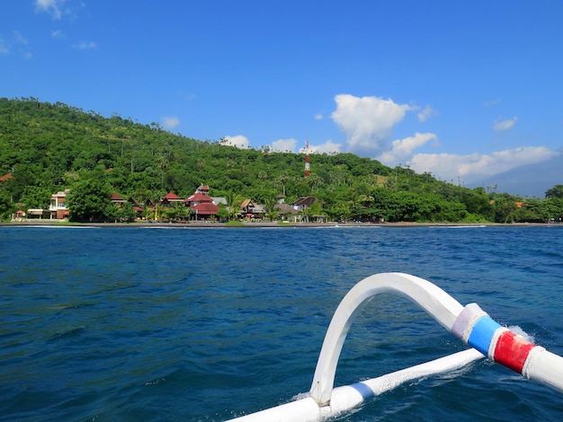 View from boat lagoon and green coast village Bali Indonesia