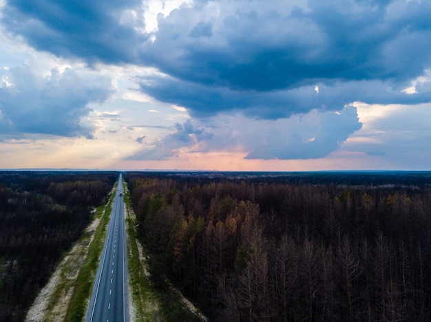 View from above of burned forest along a road