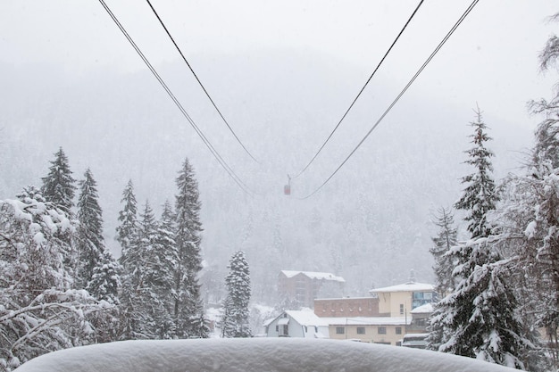 View from cableway station in the strong snowfall in the mountains of the Caucasus