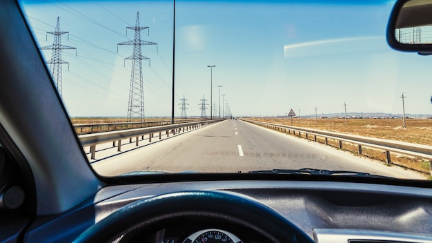 View from the car cab, driving on the highway