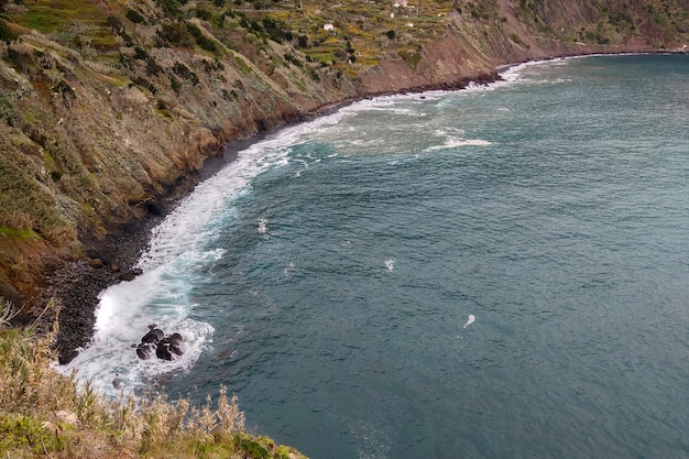 View from above on the coast of the island and the waves of the Atlantic Ocean