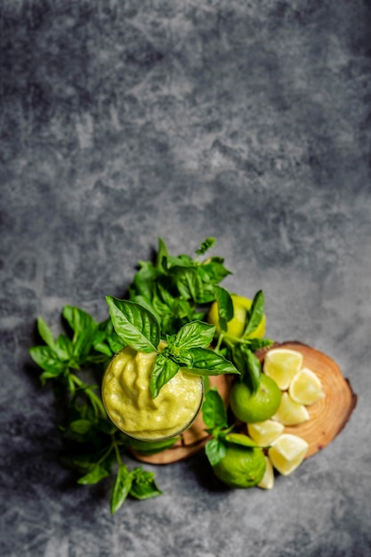 View from above of a cocktail adorned with mint leaves with copy space