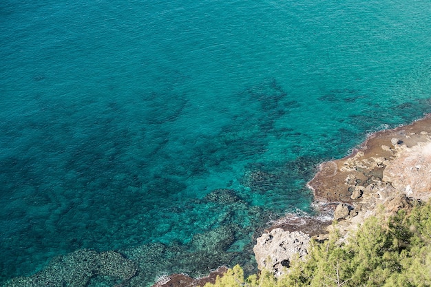 Photo view from above on the crystal clear turquoise sea.