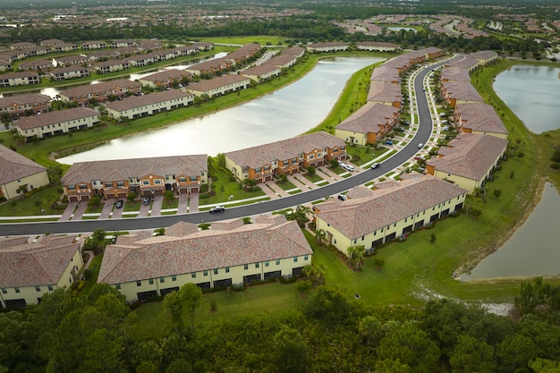 View from above of densely built residential houses in closed living clubs in south Florida American dream homes as example of real estate development in US suburbs