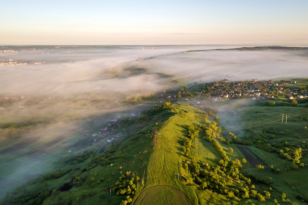 View from above of foggy green hills