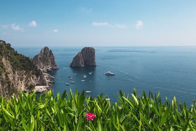 View from the Gardens of Augustus on Capri coast and Faraglioni Rocks. Italy.