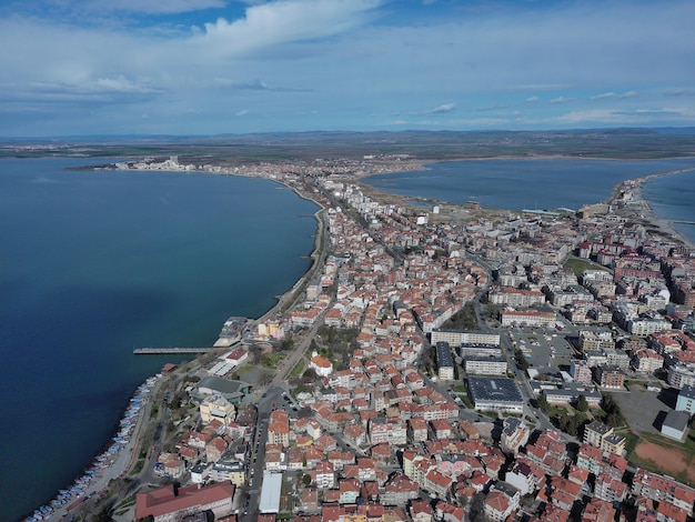 Вид с высоты на город Поморие, расположенный на полуострове Болгарии и омываемый Черным морем.