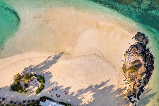 View from the height of the east coast of the island of Mauritius. Flying over the turquoise lagoon of the island of Mauritius in the area of Bel Mare.