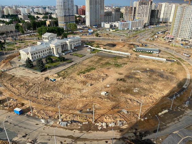 A view from a height of a large modern construction site of tall large houses