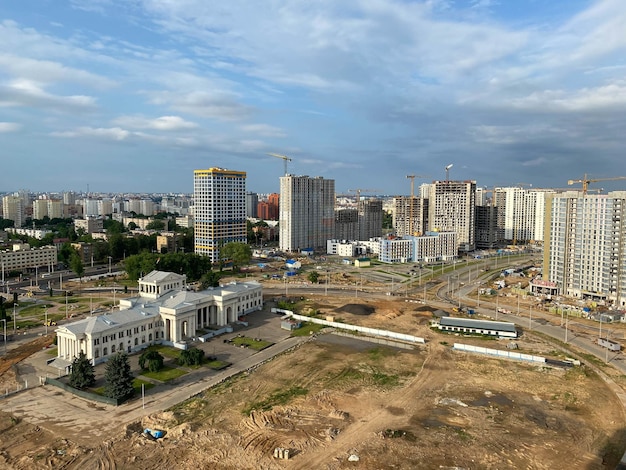 A view from a height of a large modern construction site of tall large houses and