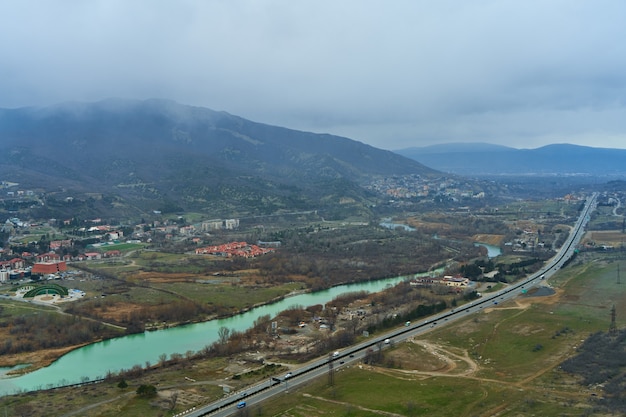 View from a height on the track next to the river in the mountains