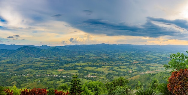 View from a large mountain to a valley with a lake in the Dominican Republic