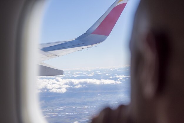 View from a plane looking to the clouds